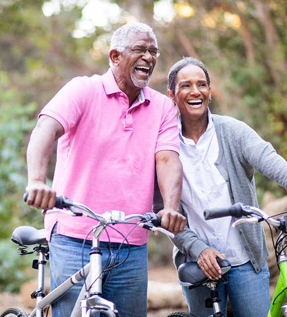 Mature couple on bikes